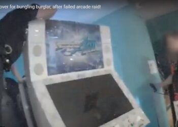 Bungling burglar caught hiding behind arcade game
