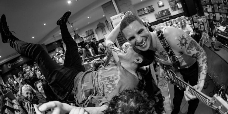 Crowd surfing and moshing in Brighton record shop
