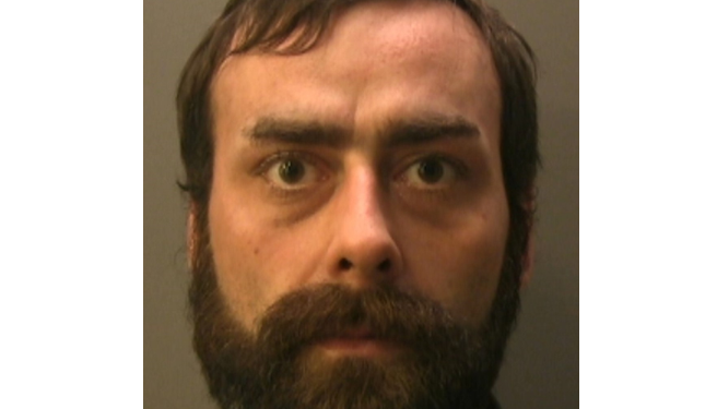 Knife-wielding post office robber jailed for 12 years