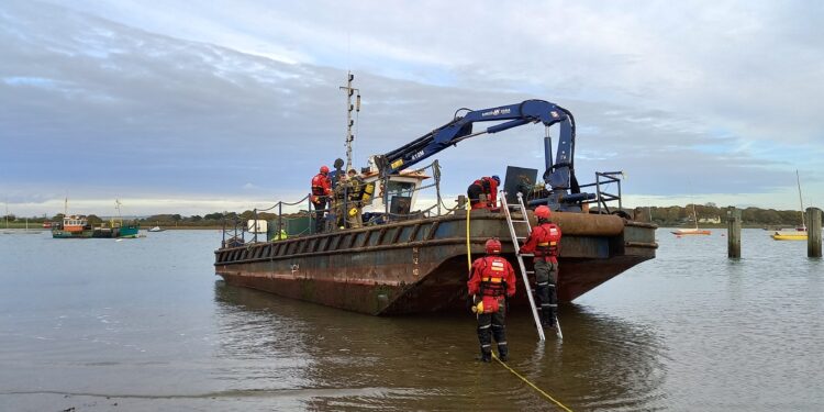 Firefighters ‘rescue’ sailor from simulated barge fire