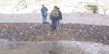 Students rescued after tide cuts them off