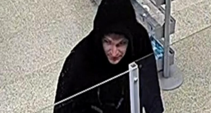 Man threatens shop staff with hammer