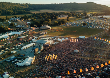 Sign falls, kills one and injures several others at festival